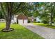Charming brick home with an attached two-car garage and inviting front yard at 256 Rose St, Mooresville, NC 28117