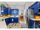 Stylish kitchen with blue cabinetry, stainless steel appliances, and a cozy breakfast nook at 256 Rose St, Mooresville, NC 28117