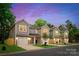 Charming new construction townhomes showcasing craftsman style architecture, garages, and landscaped yards at 2723 Capitol Dr, Charlotte, NC 28208