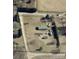 Aerial view of property with a house, outbuildings, driveway, and mature trees defining the property lines at 302 Edwards Rd, Mooresville, NC 28115