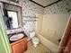 Bathroom featuring a sink, vanity, mirror, toilet, and bathtub/shower combo at 302 Edwards Rd, Mooresville, NC 28115