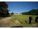 Landscaped front yard with a mailbox, carport, and a long driveway, leading to the home at 302 Edwards Rd, Mooresville, NC 28115