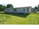 Exterior view of the home and yard at 302 Edwards Rd, Mooresville, NC 28115