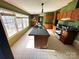 The kitchen features an island, wooden cabinets, and lots of natural light at 302 Edwards Rd, Mooresville, NC 28115