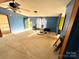 A bright living room featuring open layout, natural light, with easy access to the outdoors and other rooms at 302 Edwards Rd, Mooresville, NC 28115