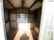 Interior of a storage shed with wooden shelves and a window at 302 Edwards Rd, Mooresville, NC 28115