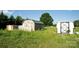 Multiple sheds in the backyard with grassy area at 302 Edwards Rd, Mooresville, NC 28115