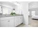 The bathroom features double sinks with granite countertops and white cabinets at 3038 Burnello Ct, Iron Station, NC 28080