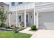 Inviting front porch featuring a welcome sign, lovely chairs, and meticulously landscaped surroundings at 3038 Burnello Ct, Iron Station, NC 28080