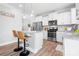 Modern kitchen featuring stainless steel appliances, granite countertops, and bar stool seating at 3038 Burnello Ct, Iron Station, NC 28080