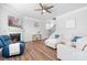 Open-concept living room with fireplace and hardwood floors at 3038 Burnello Ct, Iron Station, NC 28080