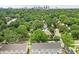 Aerial view of community near trees, with skyline in distance at 318 N Dotger Ave, Charlotte, NC 28204