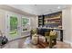 Cozy bar area with stylish decor, mini fridge and views to a private patio at 318 N Dotger Ave, Charlotte, NC 28204