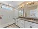 Elegant bathroom featuring double sinks, a sleek shower, and modern fixtures at 318 N Dotger Ave, Charlotte, NC 28204
