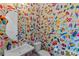 Stylish half-bathroom with a white sink, toilet, and colorful wall art adding a unique and modern touch at 318 N Dotger Ave, Charlotte, NC 28204
