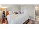 Comfortable bedroom featuring a bed, and an adjacent bathroom with sleek, modern fixtures at 318 N Dotger Ave, Charlotte, NC 28204