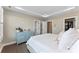 Inviting bedroom showcasing a blue dresser, fresh paint, and ensuite closet at 318 N Dotger Ave, Charlotte, NC 28204