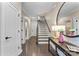Bright foyer features hardwood floors, a staircase, and decorative accents, creating a welcoming atmosphere at 318 N Dotger Ave, Charlotte, NC 28204