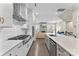 Well-appointed kitchen with modern appliances, sleek countertops, and an open design flowing into the adjacent living space at 318 N Dotger Ave, Charlotte, NC 28204