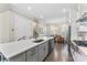 Open-concept kitchen with a large island, stainless steel appliances, and a seamless transition to the dining area at 318 N Dotger Ave, Charlotte, NC 28204