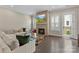Bright living room with fireplace, hardwood floors, and access to an outdoor balcony at 318 N Dotger Ave, Charlotte, NC 28204