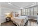 Serene bedroom with a large bed, recessed lighting, shuttered windows, and neutral tones creating a relaxing atmosphere at 318 N Dotger Ave, Charlotte, NC 28204