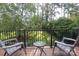 A cozy back deck featuring a table and chairs with a beautiful backyard view at 3604 Golfview Dr, Gastonia, NC 28056