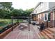 Backyard brick patio features an outdoor dining area and lounge space for entertaining at 3604 Golfview Dr, Gastonia, NC 28056