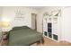 Well-lit bedroom with decorative shelving and a bed with an olive green comforter at 3604 Golfview Dr, Gastonia, NC 28056