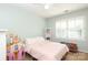 Bright bedroom with shuttered windows and space for playing and a pink bed at 3604 Golfview Dr, Gastonia, NC 28056