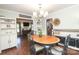 Bright dining room featuring hardwood floors, ample natural light, and stylish decor, perfect for meals and entertaining at 3604 Golfview Dr, Gastonia, NC 28056