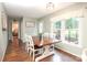 Bright dining room featuring hardwood floors, natural light, and stylish decor, perfect for meals and entertaining at 3604 Golfview Dr, Gastonia, NC 28056