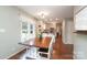 Cozy dining room featuring wood table, white chairs, and natural light, perfect for gatherings at 3604 Golfview Dr, Gastonia, NC 28056