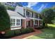Charming brick home boasts a spacious front lawn, a second-story porch, and an inviting entrance at 3604 Golfview Dr, Gastonia, NC 28056