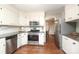Charming kitchen features stainless steel appliances, granite countertops, and white cabinetry at 3604 Golfview Dr, Gastonia, NC 28056