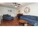 Spacious living room with hardwood floors, ceiling fan, and ample seating at 3604 Golfview Dr, Gastonia, NC 28056