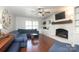 Inviting living room boasts a fireplace, built-ins, hardwood floors, and lots of natural light at 3604 Golfview Dr, Gastonia, NC 28056