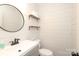Modern powder room featuring shiplap walls, a stylish mirror, and contemporary fixtures for a sleek, updated look at 3604 Golfview Dr, Gastonia, NC 28056