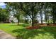 Spacious backyard with mature trees providing shade and privacy in a serene setting at 3810 Yorkford Dr, Charlotte, NC 28269