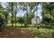 Lush backyard featuring mature trees for a serene outdoor retreat at 3810 Yorkford Dr, Charlotte, NC 28269