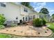 Well-maintained backyard with a deck, patio, lush landscaping, and manicured lawn at 3810 Yorkford Dr, Charlotte, NC 28269