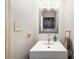 Bathroom featuring a modern sink, large mirror, and dark-wood accent cabinet at 3810 Yorkford Dr, Charlotte, NC 28269