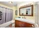 Well-lit bathroom with a vanity, large mirror, and a shower-tub combination at 3810 Yorkford Dr, Charlotte, NC 28269