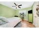 Comfortable bedroom with hardwood floors, a ceiling fan, and a window with natural light at 3810 Yorkford Dr, Charlotte, NC 28269