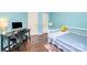 Bright and airy bedroom with wood floor featuring a daybed, desk, and charming decor at 3810 Yorkford Dr, Charlotte, NC 28269