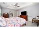 Spacious bedroom with tray ceilings, large dresser and TV, and floral pattern bedding at 3810 Yorkford Dr, Charlotte, NC 28269
