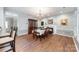 Elegant dining room featuring a chandelier, fireplace and hardwood flooring at 3810 Yorkford Dr, Charlotte, NC 28269