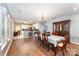 Open concept dining room, with view of the kitchen with hardwood floors and ample lighting at 3810 Yorkford Dr, Charlotte, NC 28269