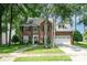 Charming brick home featuring a well-manicured lawn and a two-car garage at 3810 Yorkford Dr, Charlotte, NC 28269