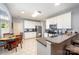 Efficient kitchen with white cabinetry and stainless appliances, with a breakfast table at 3810 Yorkford Dr, Charlotte, NC 28269